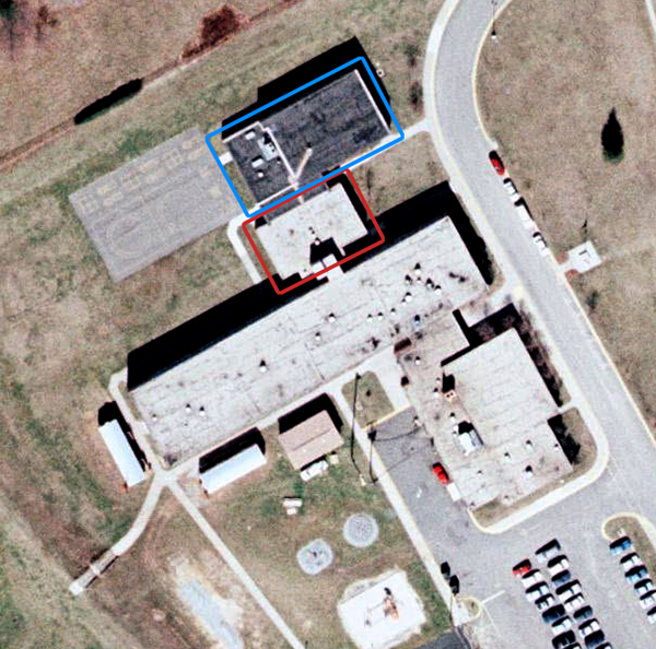 Aerial photograph of Clermont Elementary School taken in 1990. Sections of the school are highlighted as described in the caption.