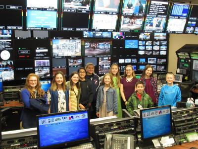 Students standing in a tv control room