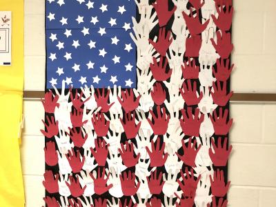 Hand prints that make up the American Flag